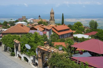 City view with church tower and red roofs under blue sky, Church of St. George, Sighnaghi, Signagi,