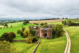 DefaultAutumn Colours over ruins of Pembridge Castle or Newland Castle from a drone, Herefordshire,