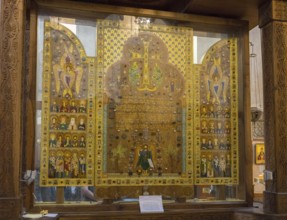 Icons and sacred symbols in an intricately designed glass display case in a church, Sameba