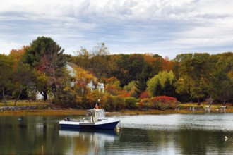 Scenic river landscape, lobster boat, riverbank fishing boat, autumn leaves, Indian summer,