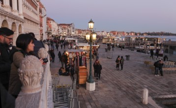 People on Ponte della Paglia and Riva degli Schiavoni, Venice, Veneto, Italy