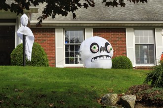 Ghost and skull in front garden Halloween decoration, Ogunquit, Maine, New England, USA