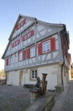 Sculpture boy with tuba by Guido Messer 1991, music school, half-timbered house, making music,