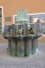 Guild fountain by Bonifatius Stirnberg 1983, sculptures on the history of the city with historic