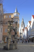 Lindenbrunnen and Wilhelmstraße with Gothic St. Mary's Church, pedestrian zone with pedestrians,