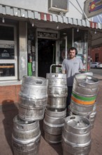 Arvada, Colorado - Empty beer kegs stacked outside Cheapskates sports bar in Olde Town Arvada