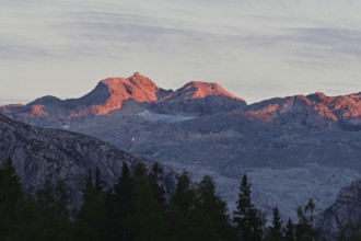 The summit of the Hochkönig with the Matrashaus in the last light at sunset, seen from the