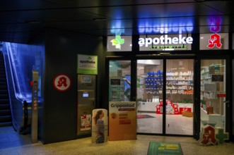 Night view, pharmacy city center, logo, underpass, escalator, neon light, illuminated, Stuttgart,