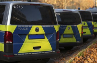 Various police vehicles, police cars, police vans, from behind, parked, Stuttgart,