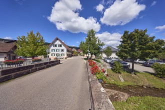 Car bridge and pedestrian bridge, Hofstetterbach stream, sandstone, flower boxes, zonal geranium