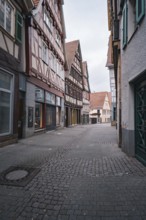 Charming old town street with half-timbered houses and small shops, Herrenberg, Böblingen district,