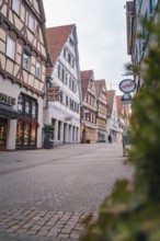 Malersische Altstadtstraße with half-timbered houses and shops, Herrenberg, Böblingen district,