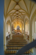 View of a church interior with altar and arranged seats, Gothic architecture, collegiate church,