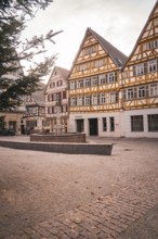 Charming half-timbered houses surround a quiet square, relaxed atmosphere, Herrenberg, Böblingen