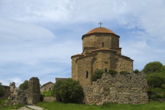 Historic church ruin with stone tower against a blue sky, Javari Monastery, Jvari Monastery,