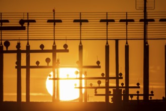 Runway lighting, approach aids, at Düsseldorf International Airport, sunset, Hauptbahn Süd,