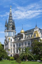 Tower with golden dome in an impressive building with palm trees, Astronomical Clock, Black Gold