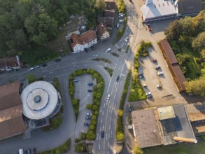 Aerial view of an urban intersection with surrounding buildings and trees, Deer E-Mobility Shuttle