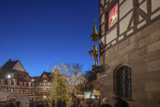 View of the Christmassy decorated Tiergärtnertorplatz in the evening lighting, on the right the
