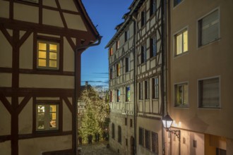 Historic half-timbered houses with a view of the Christmassy decorated Tiergärtnertorplatz in the
