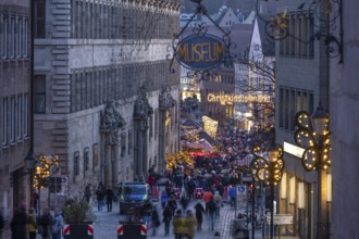 View of the secured entrance to the Nuremberg Christmas Market in the evening, on the left the