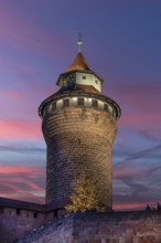 Historic Sinwell Tower, in the evening sky, built in the 13th century, Kaiserburg, Nuremberg,