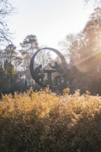Metal sculpture in a sunny park in autumn light, Stadtgarten Pforzheim, Germany