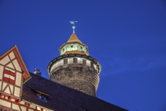 Sinwell Tower built in the 13th century, on the Nuremberg Kaiserburg in the evening lighting, blue