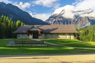 Mount robson provincial park welcome center building rising against majestic mountains and lush