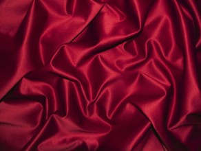 Elegant red satin with shiny shimmer and ornate wrinkles, clothing, background, velvety, solemn,
