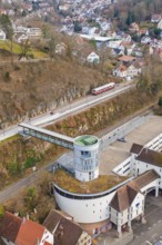 Architecture and a train on an elevated position with a view of houses and other buildings,