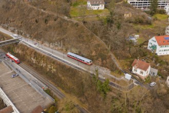 Zug moves through a varied landscape of hills and buildings in a wintry atmosphere, historic event,