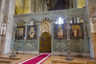 Altar of a church with impressive icons and wall paintings, Svetitskhoveli Cathedral,