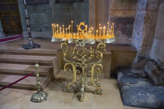 Bronze candle holder on an altar giving a church a solemn atmosphere, Svetitskhoveli Cathedral,