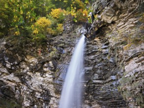 Diesbach waterfall in autumn-colored surroundings, Linthal, Klausenpass, Canton of Glarus,