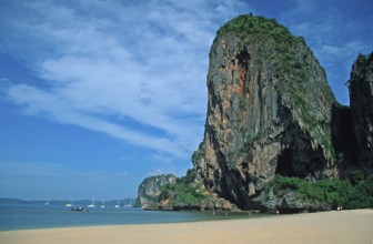 Rocks and boats on Pranang Cave beach, two years in front of the tsunami, Krabi, Thailand, December