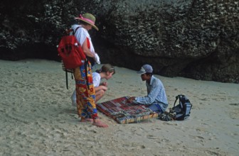 Jewelry sellers and customers on Pranang Cave beach, two years in front of the tsunami, Krabi,