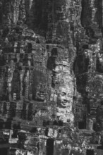 Huge stone-carved faces of Bodhisattva Lokeshvara, also Avalokiteshvara, Bayon Temple, Angkor Thom,