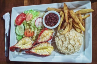 Plate of breaded shrimp with rice on the table with COPY SPACE, menu of breaded shrimp served on