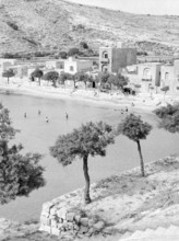 Xlendi Beach, Island of Gozo, Malta, Europe, 1956 thought to be British servicemen on the beach and