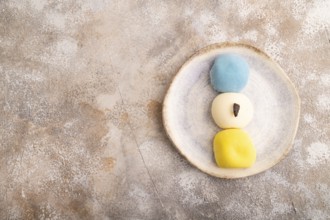 Japanese Mochi Cakes on brown concrete background, top view, flat lay, copy space