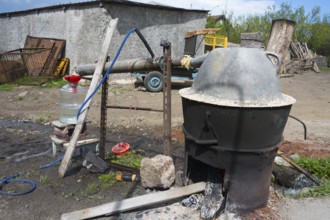 Handmade distillation plant with metal container, liquor production, Sameba, Kvemo Kartli region,