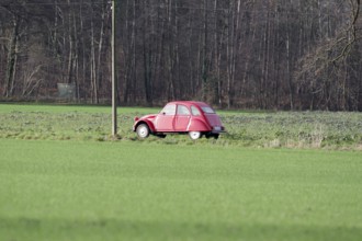 Citroën 2CV, car, duck, red, classic car, rural, Germany, A single Citroën drives on a country road