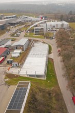 Aerial view of an industrial area with buildings and parking spaces, parking garage construction