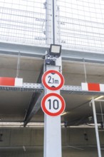 Traffic signs for height and speed restrictions in parking garages, parking garage construction
