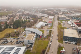 Urban landscape with industrialized areas and buildings in winter, parking garage construction with