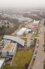 Further view of an industrial building within an urban landscape in winter, parking garage