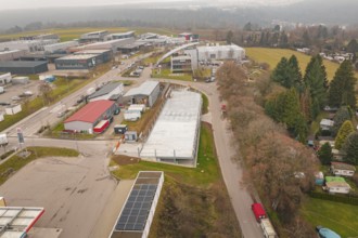 View from above of an urban environment with roads and buildings in winter, parking garage