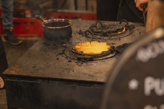 Waffles are freshly prepared on a hot oven at a market stand, Weihnachtsmark Nagold, LandkreiScalw,