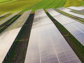 Close-up of solar systems spanning fields, energy transition, construction of PV open space,